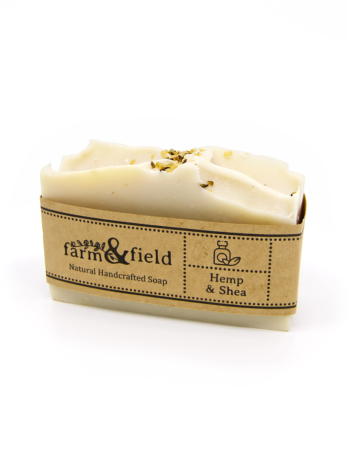 A bar of Farm & Field Hemp & Shea natural handcrafted soap wrapped in a kraft paper sleeve, shown on a clean white background.
